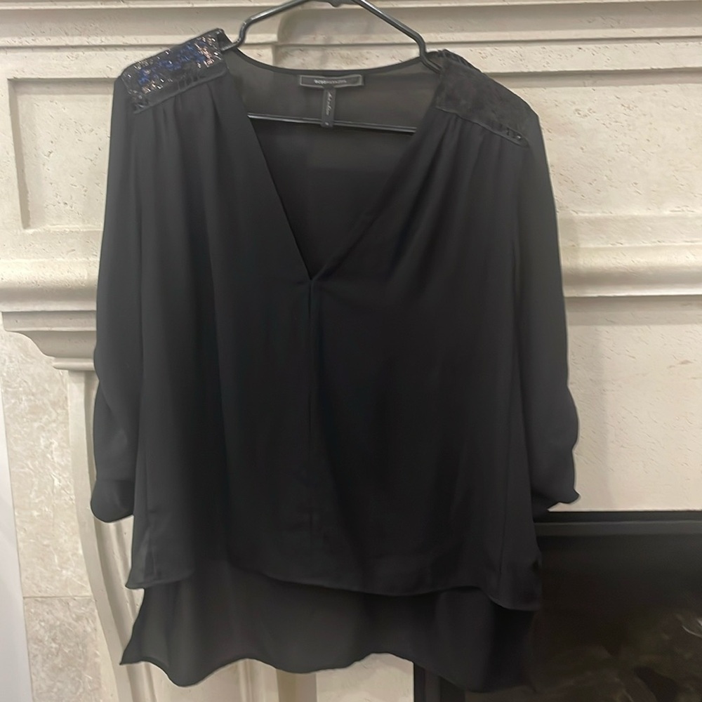 BCBG black v-neck sequins shoulder detail, high low blouse. Size medium.